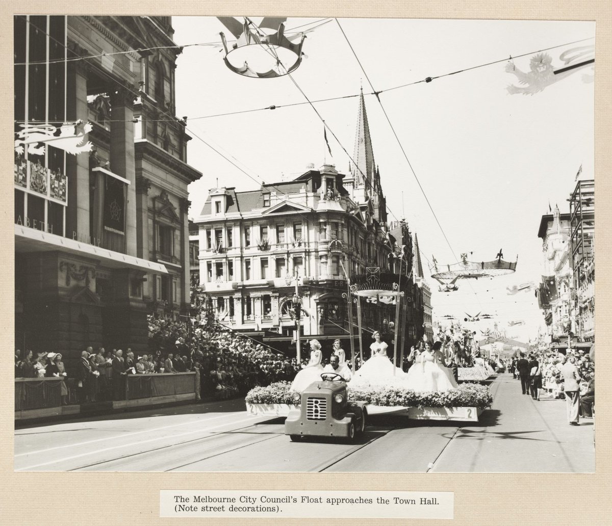 The Melbourne City Council's Float approaches the Town Hall. (Note street decoration) (1954)