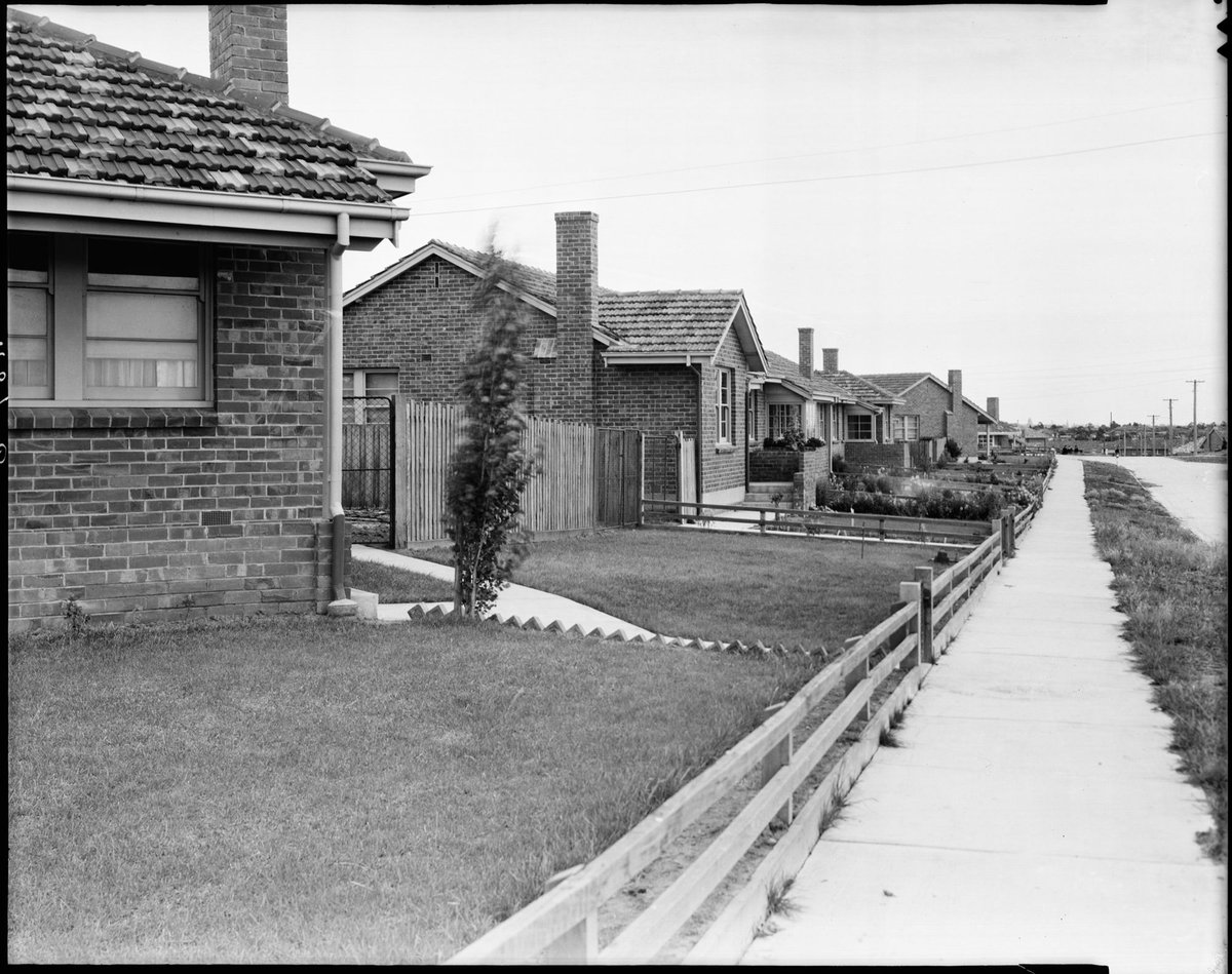 Street view of one side of a road in a Housing Commission estate, Coburg, Preston and Heidelberg area (c. 1947)