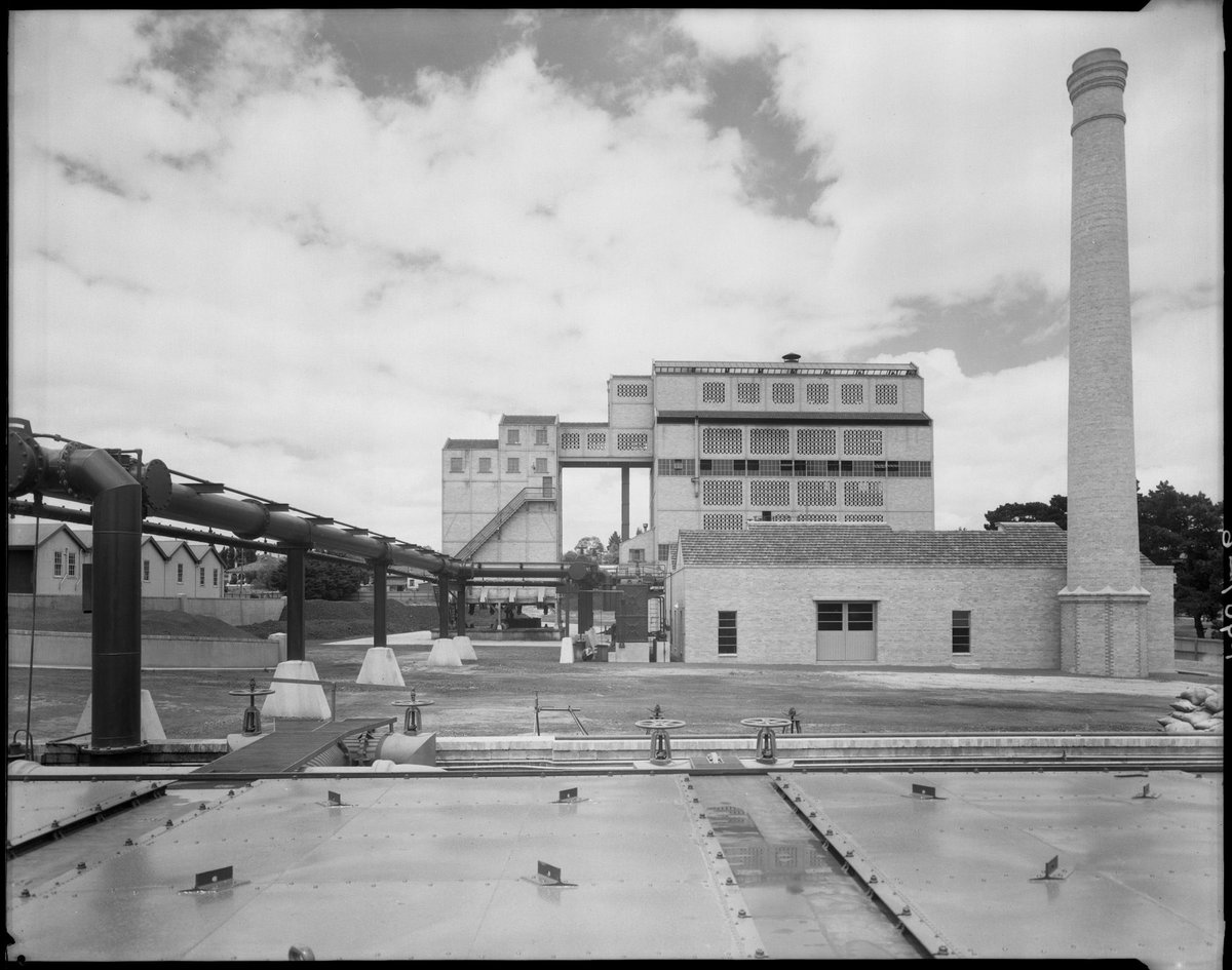 Exterior view from one factory building towards another with chimney, Colonial Gas Association, Box Hill (c. 1945)