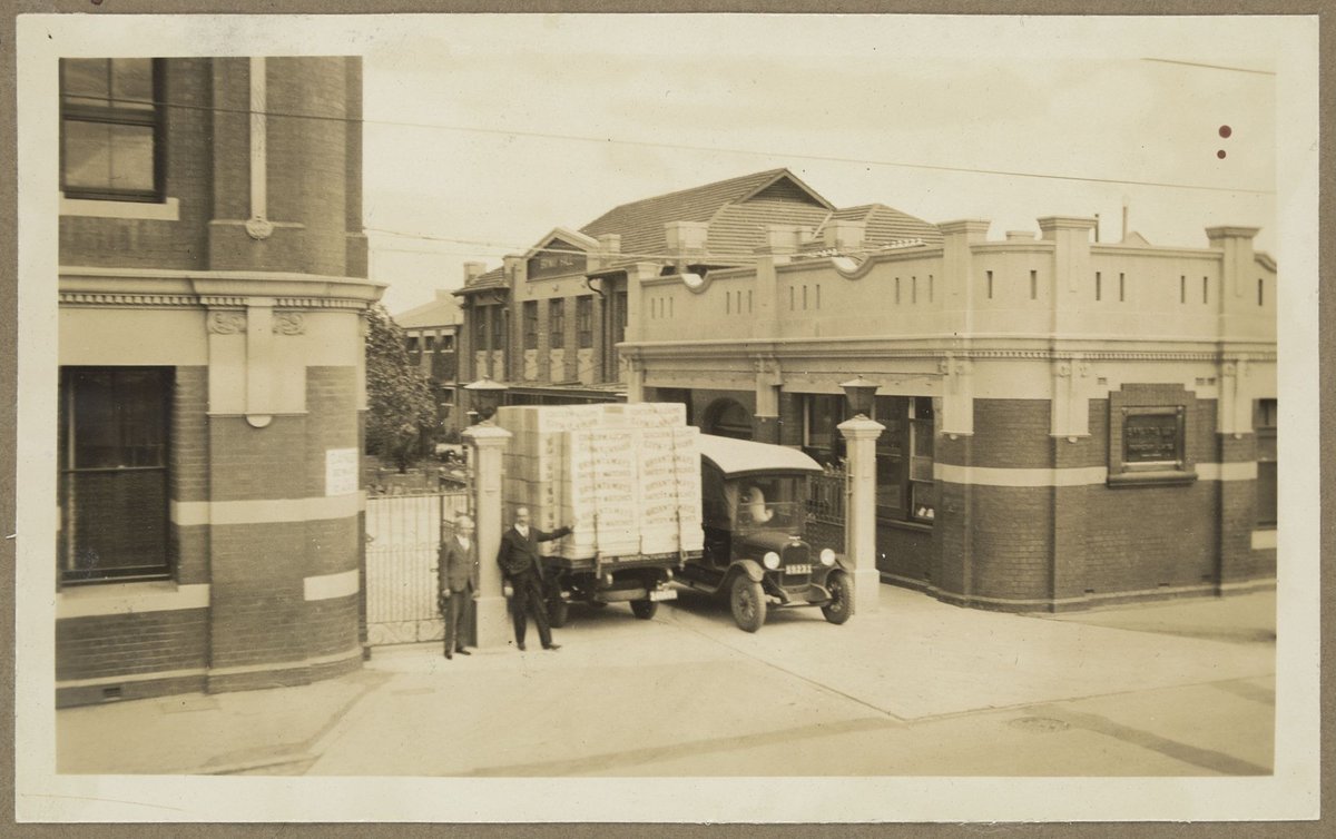 Vehicles entering and leaving through gates of Bryant & May, Richmond (1928)