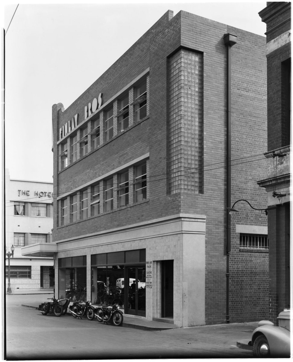 Side view, Finlay Bros. Motorcycles Shop and Bry-Law Motors, 316-324 Elizabeth Street, Melbourne, Melbourne City (c. 1941)