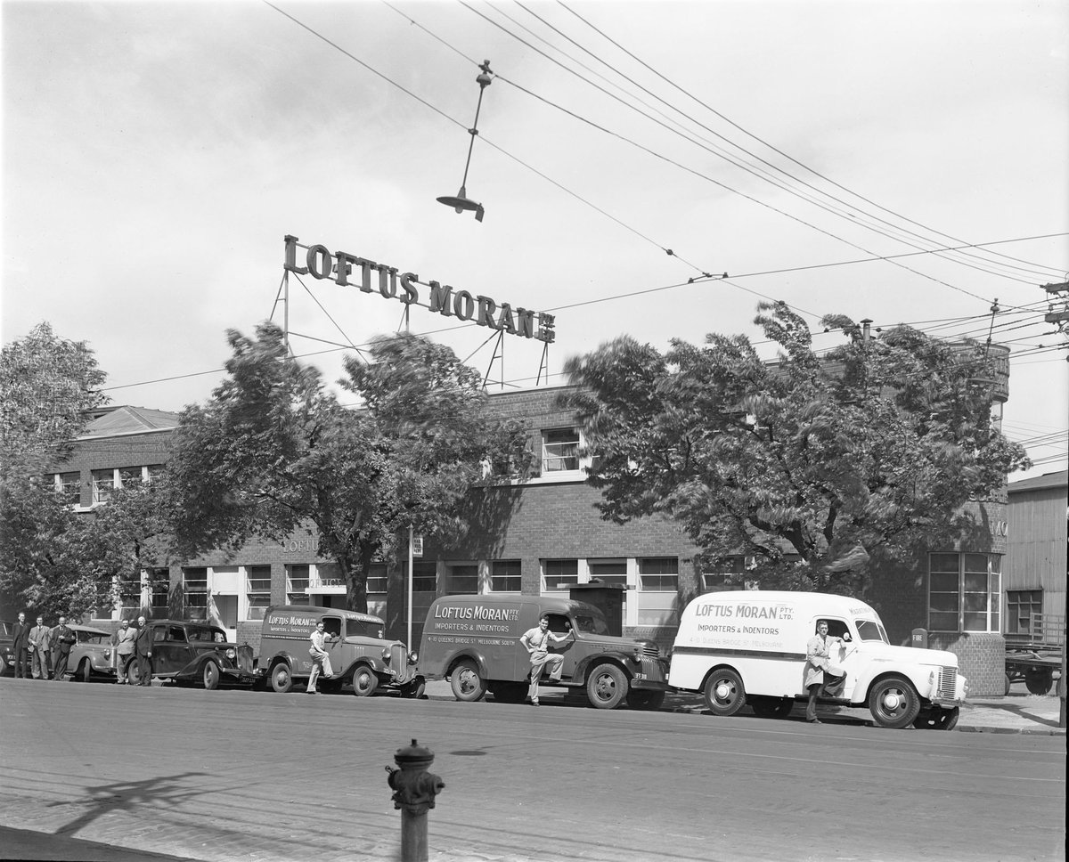 Delivery vans parked outside Loftus Moran P/L, importers and indenters, 4-10 Queens Bridge St., South Melbourne, Melbourne City (1947)