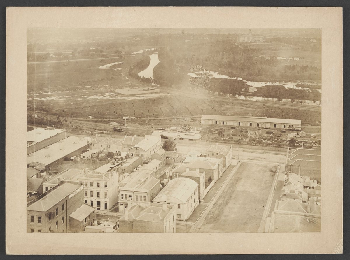 Looking South showing Flinders and Russell Streets, Yarra River and Government House, Melbourne City (1875)