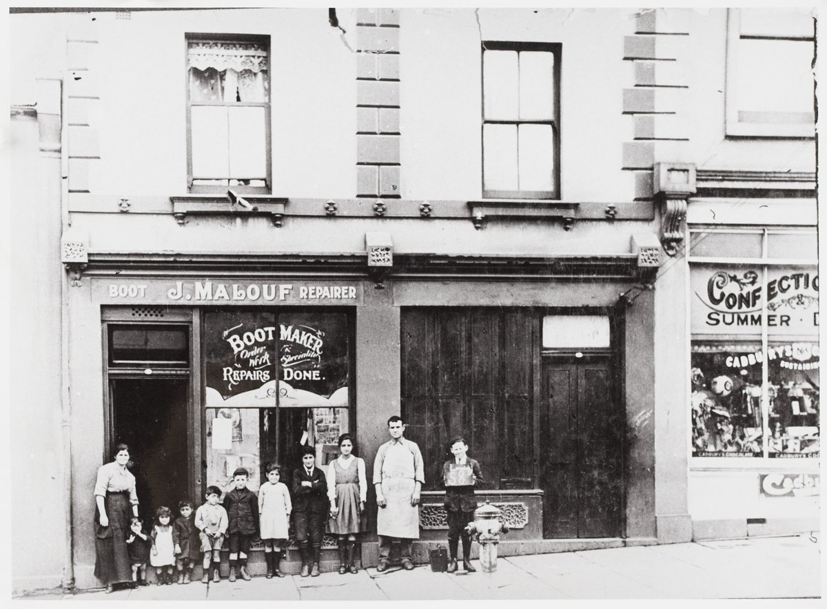 Joseph and Susan Malouf and family outside their shop and dwelling at 58 Lonsdale St., Melbourne, 1918, Melbourne City