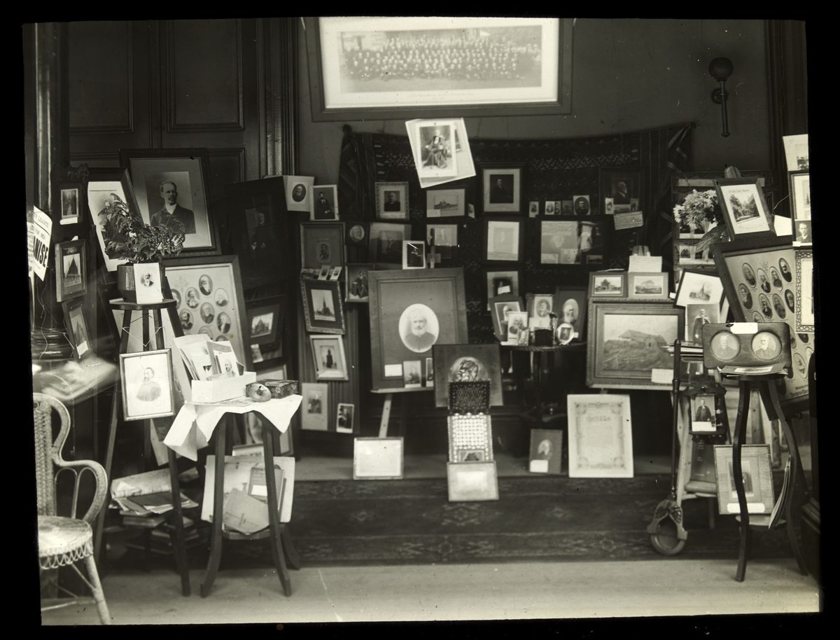A stall at the Missions Bazaar, Melbourne Town Hall, with books and pictures for sale, Melbourne City (1915–24)