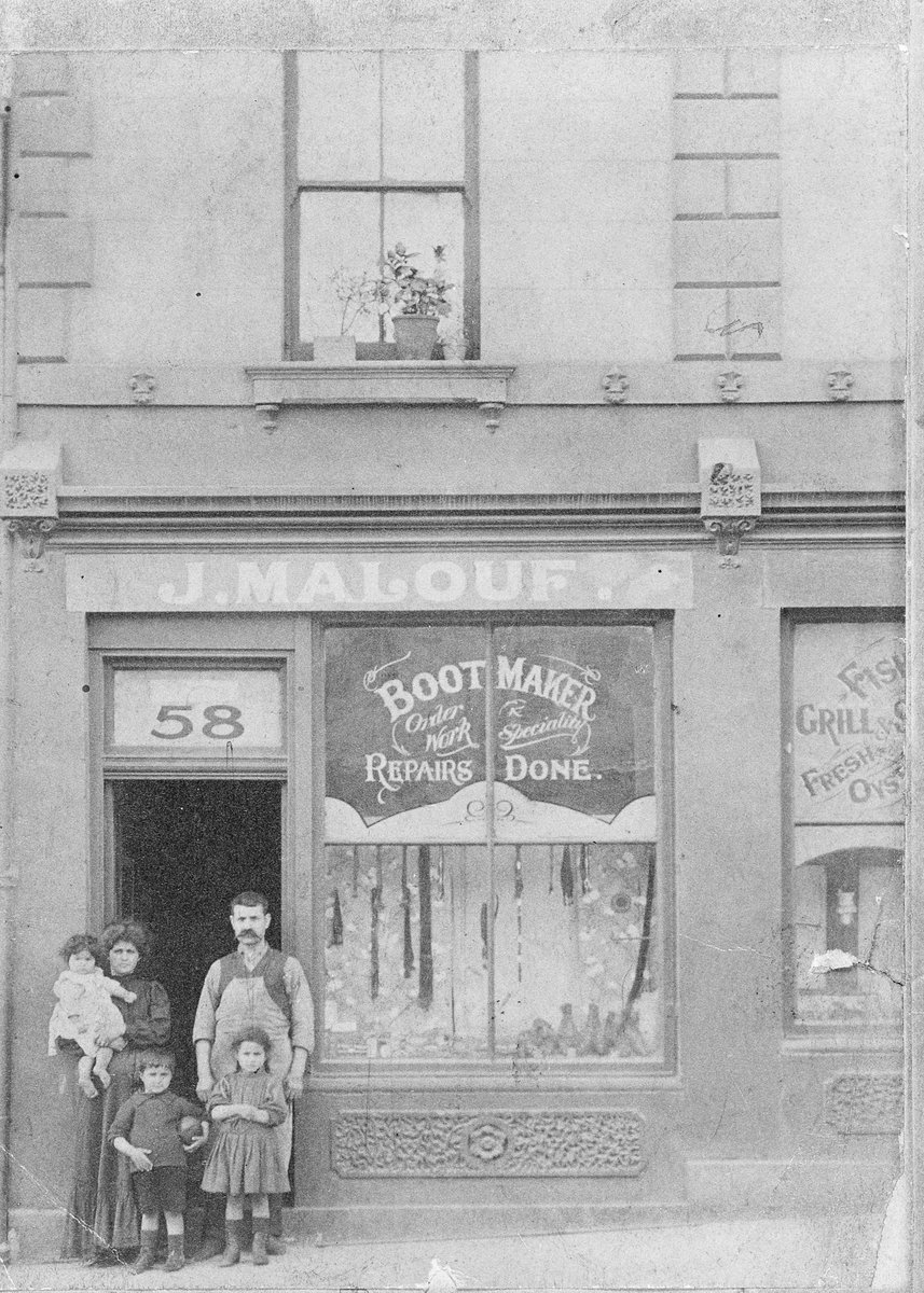 Susan and Joseph Malouf and children outside their shop and dwelling at 58 Lonsdale St. Melbourne, 1911, Melbourne City
