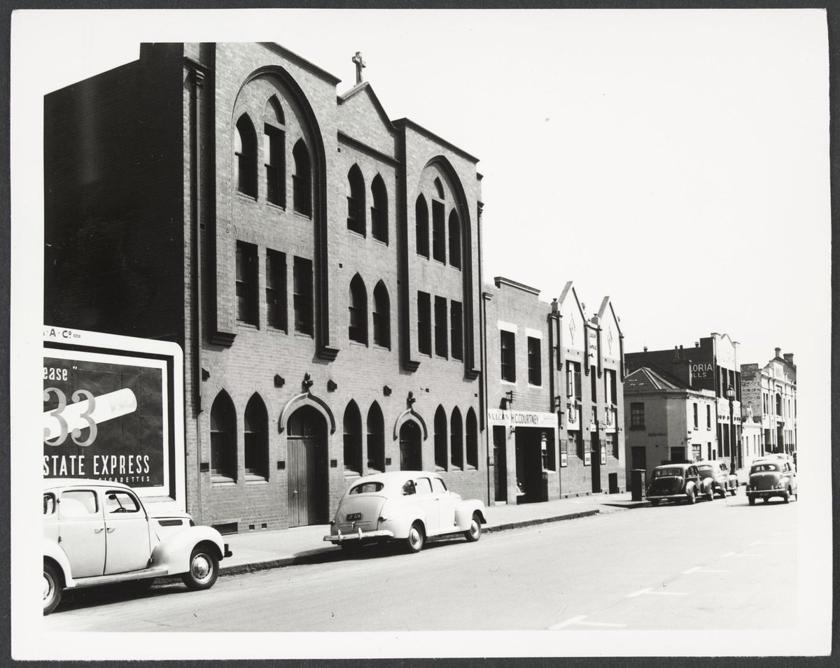 Spring Street - west side, near corner with Little Lonsdale Street, showing Church of England Mission House, Melbourne City (1950)