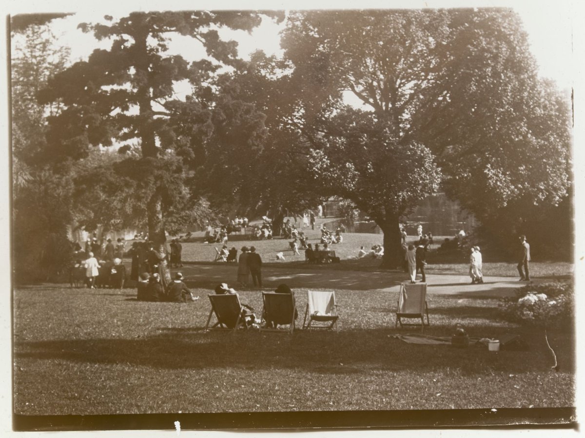 People relaxing in the Botanic Gardens (?), Melbourne, Melbourne City (1880–1938)