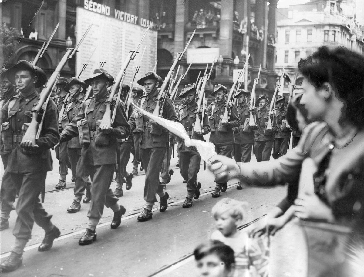 4th and 15th Brigades A.I.F. march past Melbourne Town Hall, Melbourne City (c. 1944)