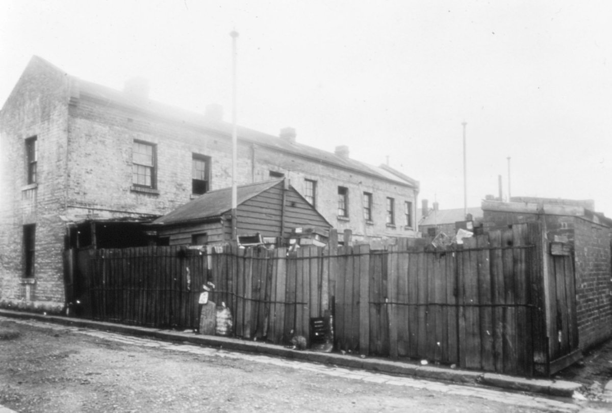 Melbourne. Street scene featuring two storey brick building (c. 1935)