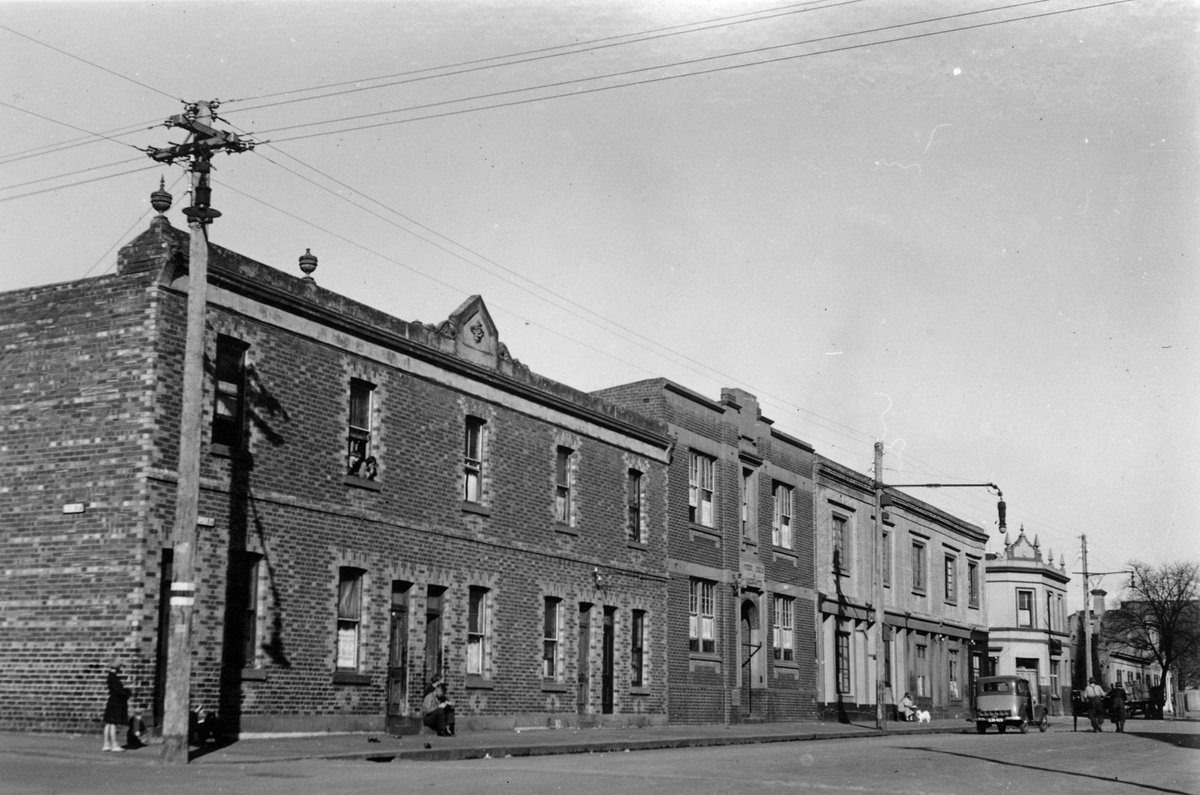 Napier Street, Fitzroy, east side opposite the Fitzroy Town Hall, looking south from the corner of Moor Street (c. 1935)