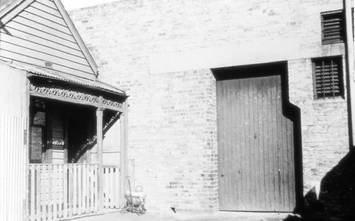 Melbourne. Weatherboard house and brick building (c. 1935)