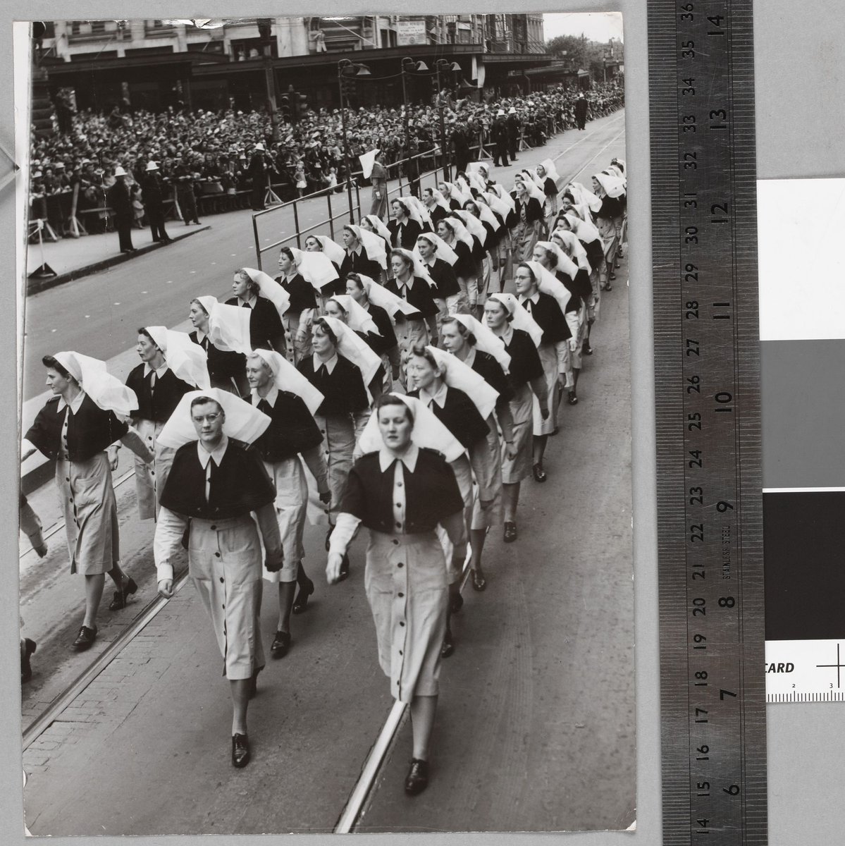 Air Force Nurses eyes-right at the [Melbourne] Town Hall Saluting Base, Melbourne City (c. 1940)