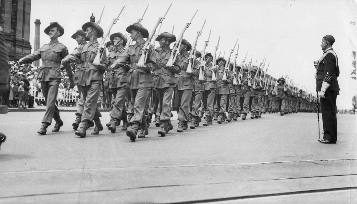 Soldiers marching past Parliament House for Victory Contingents march in Melbourne, East Melbourne (1943–49)