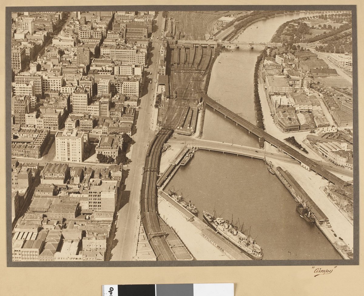 View of the Yarra River showing Flinders Street Railyway Yards and railway bridge, Melbourne City (1927–28)