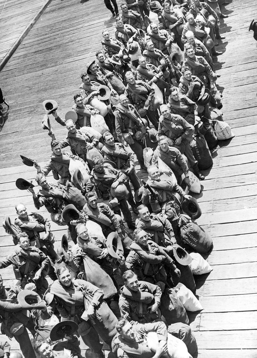 A.I.F. troops line up on pier during embarkation from Port Melbourne, before boarding ship (1941)