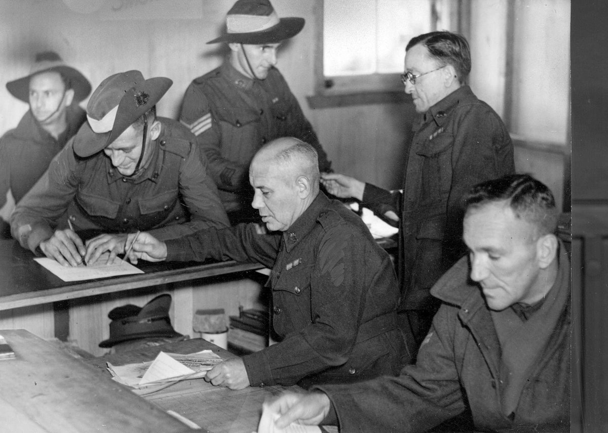 Dischargees signing papers at S.D.D. Royal Park, Parkville (1941–47)