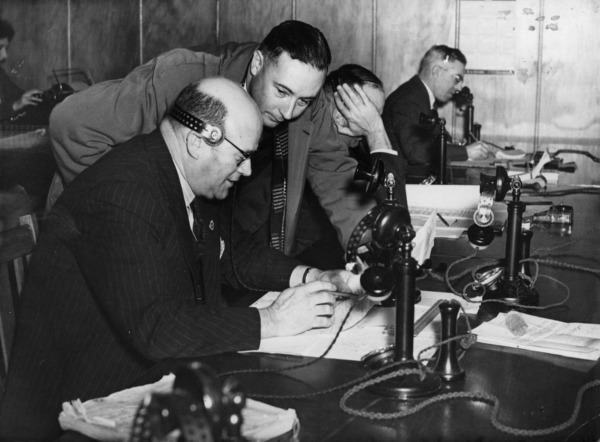 Staffing the telephones at the National Service Rooms in Elizabeth Street, Melbourne, Melbourne City (c. 1942)