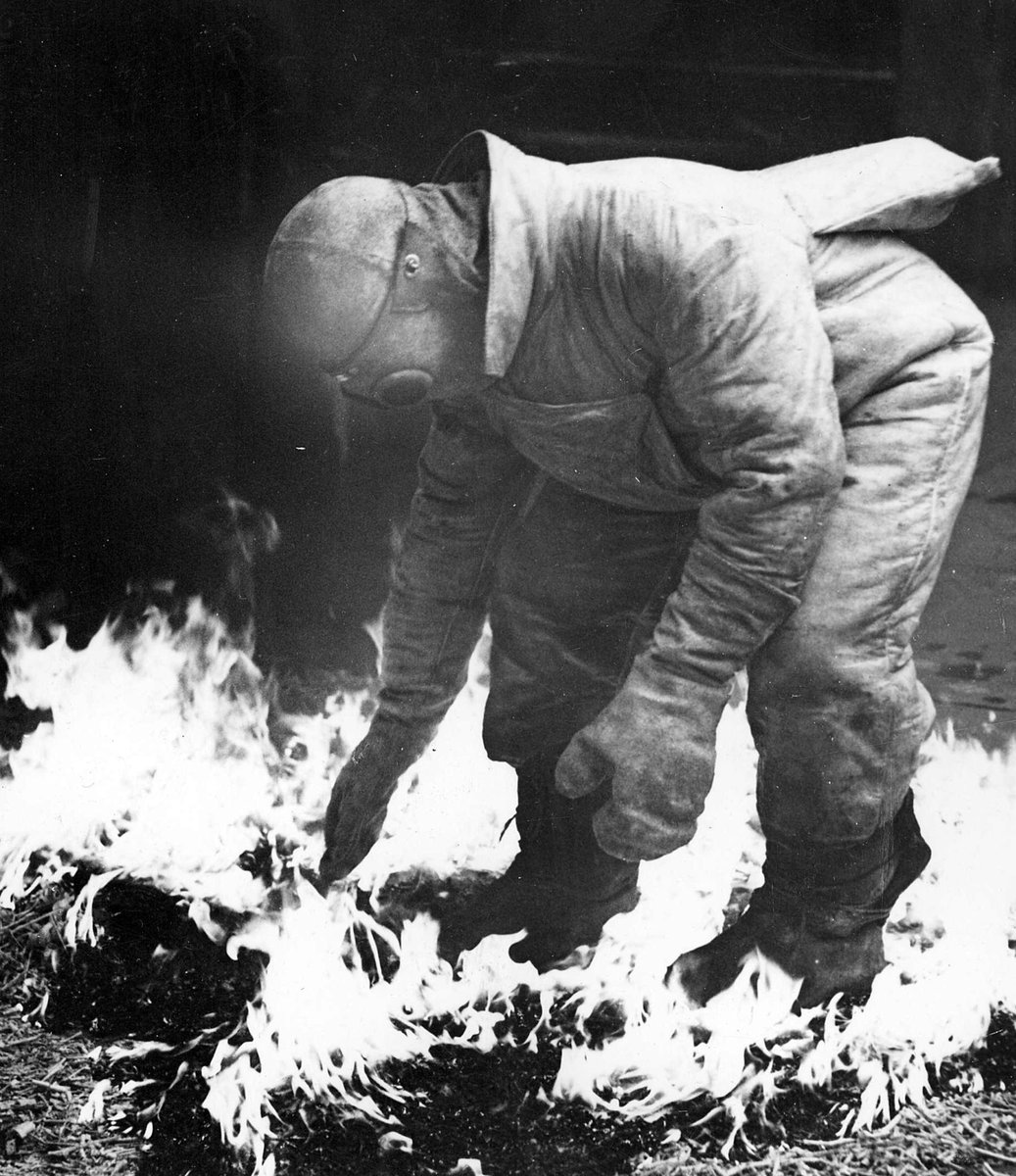 Testing fire armour A.R.P. [i.e. Air Raid Precautions] Melbourne (c. 1941)