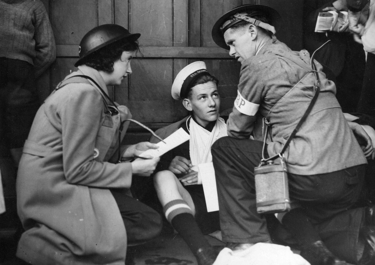 Miss Margaret McBrien, Sea Scout Hitchcock (H.E. victim) & W. Walsh, stretcher bearer, at sector 7C8 Nth Melb. [i.e. North Melbourne] (c. 1942)