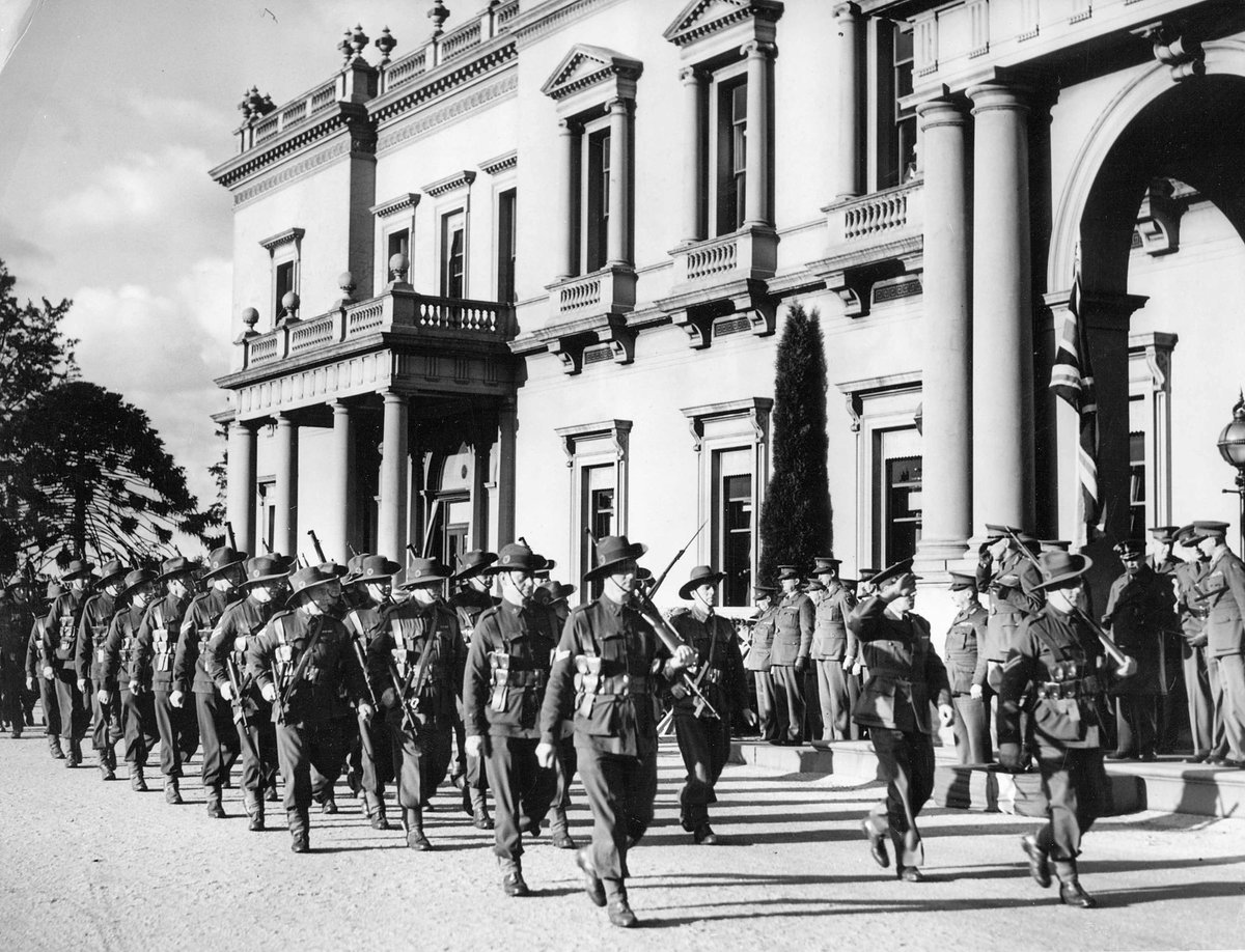 Troops marching past Government House in Melbourne, Melbourne City (c. 1943)