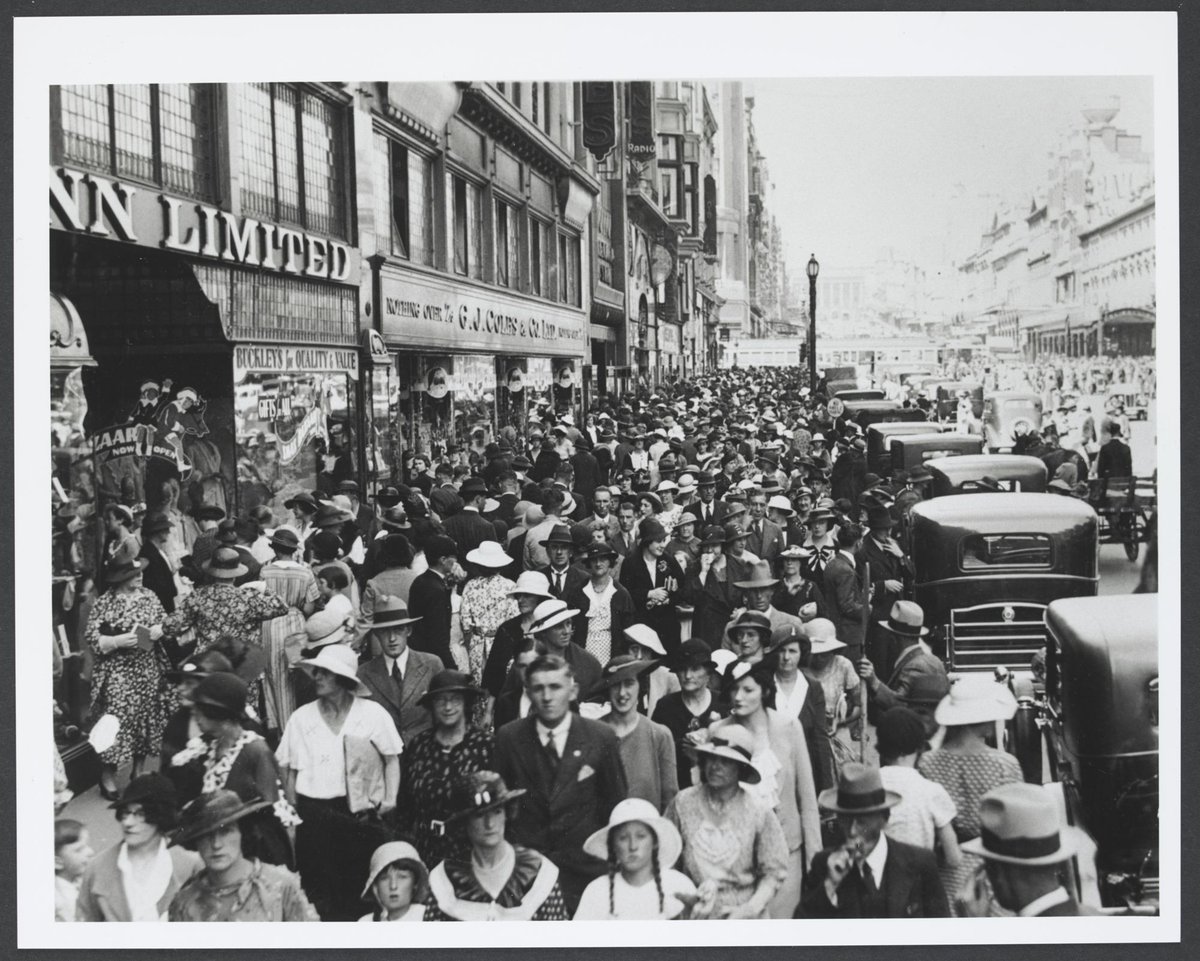 Looking east towards huge crowd in Bourke Street in front of Coles Variety Store in Deva House Melbourne Store No. 4, Melbourne City (1930–35)
