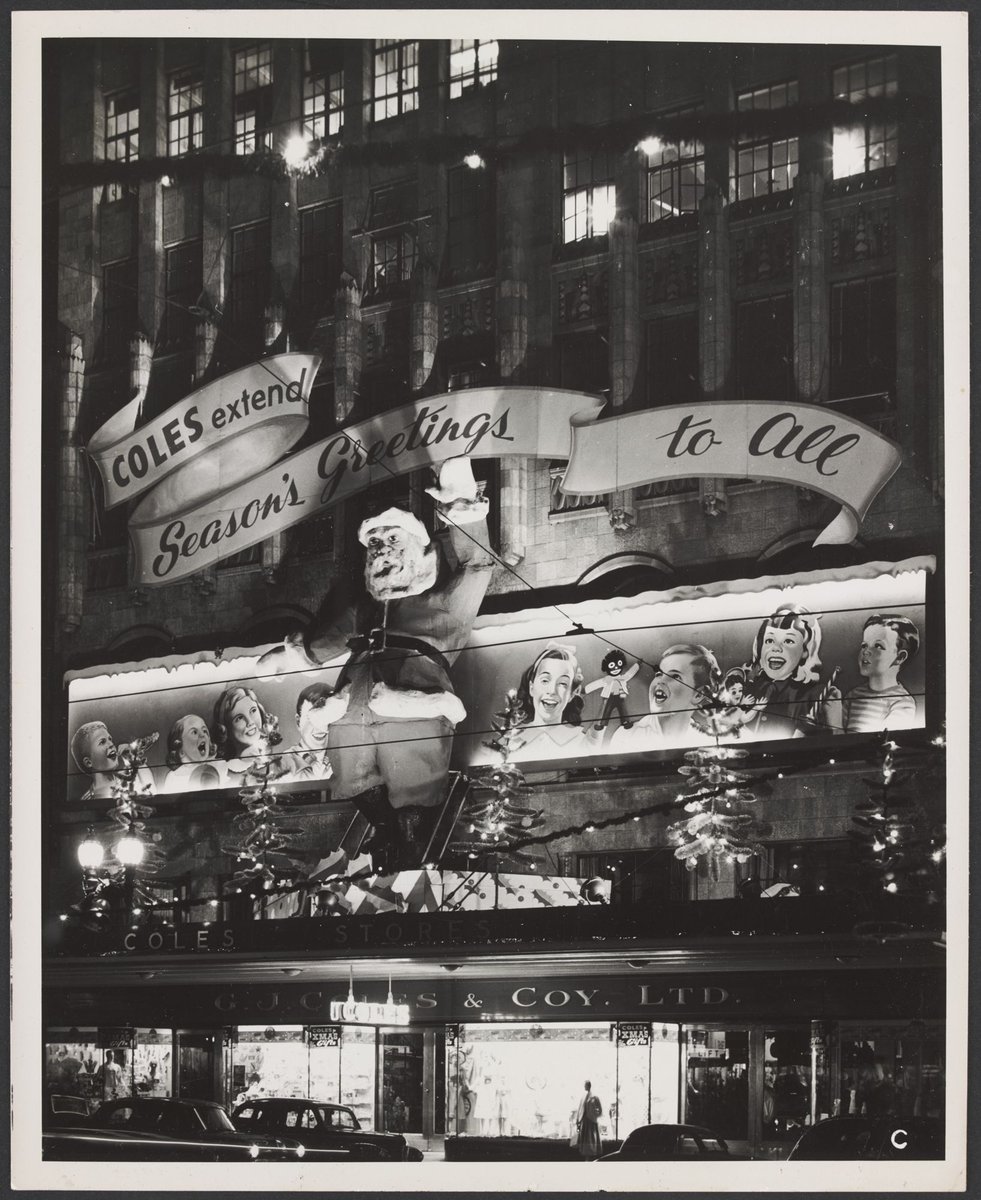 Christmas decorations on exterior of Coles Bourke Street store with seasonally greetings message Store No. 12, Melbourne City (1954)