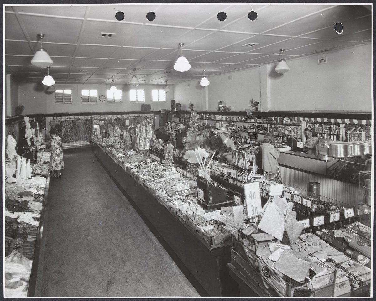 Interior showing female customers at counters displaying clothing and toiletries also a refreshment bar in Coles Frankston Store No. 118 (1945–49)