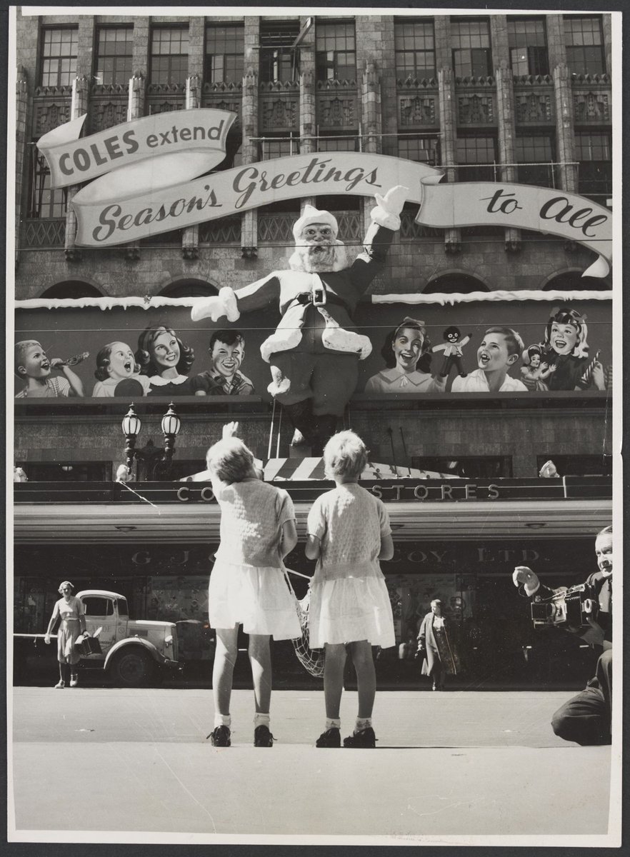 Two girls looking at Christmas decorations on the Coles Bourke Street Store No. 12, Melbourne City (1954)