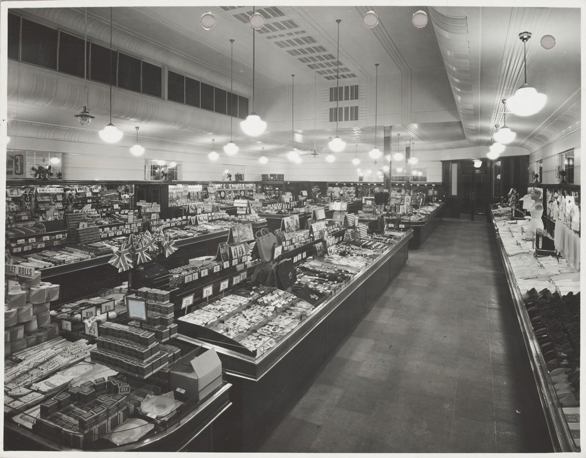 Elevated view of interior showing counters displaying women's clothing toiletries and haberdashery at Coles St. Kilda Store No. 64, St Kilda (1947)