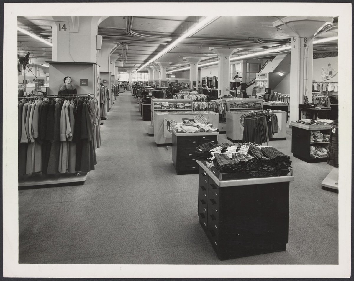 Ladies and children's clothing section with clothing on racks and counters, Mantons Bourke Street store, Melbourne City (1942–51)