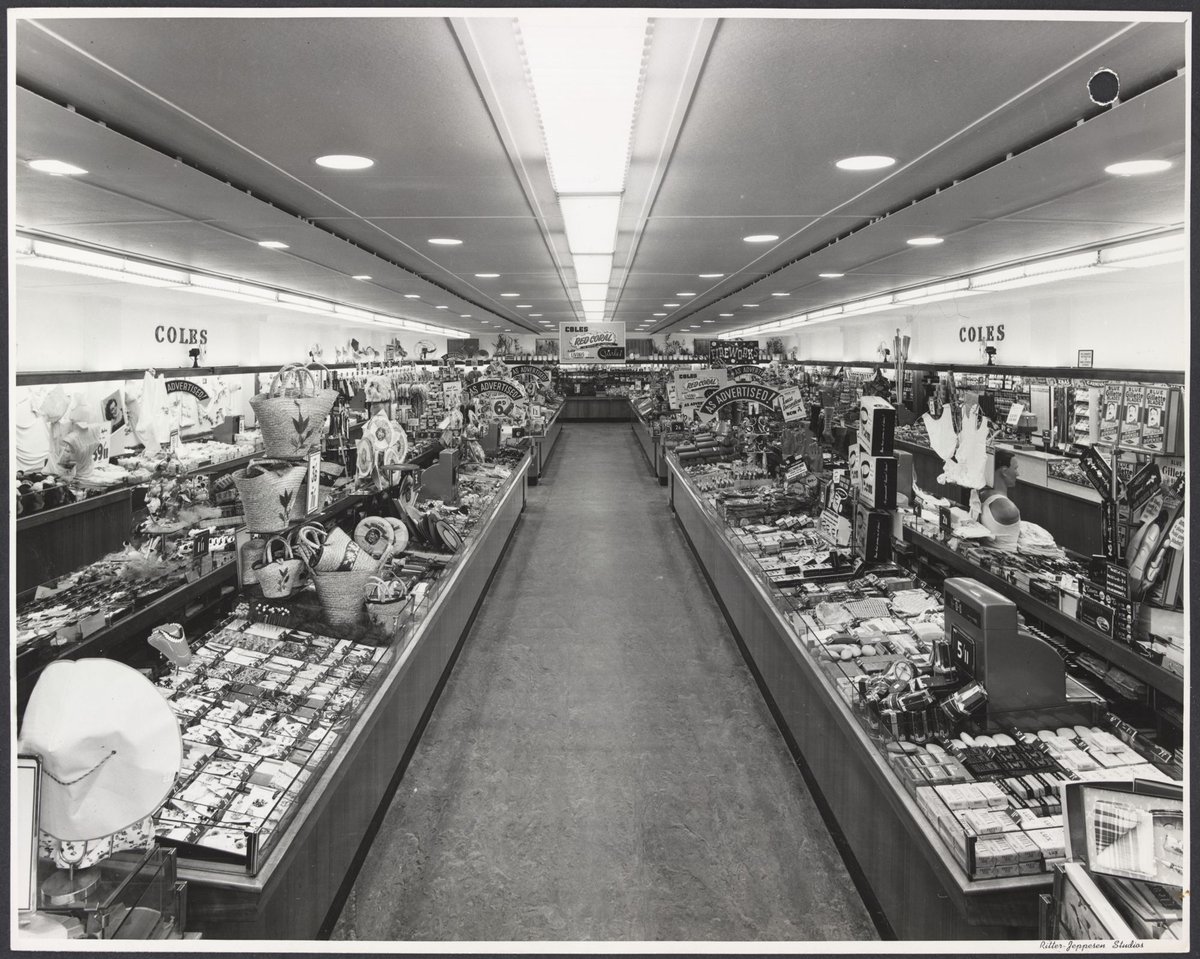 Interior showing counters displaying clothing toiletries and baskets with advertisement for Starlet cosmetics at rear of Coles Frankston Store No. 118 (1945–49)
