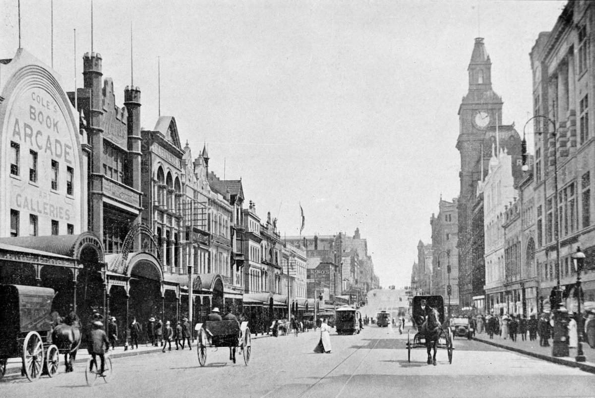 Bourke Street looking west with Coles Book Arcade on left GPO clock tower on right pedestrians and horse-drawn vehicles, Melbourne City (1900–10)