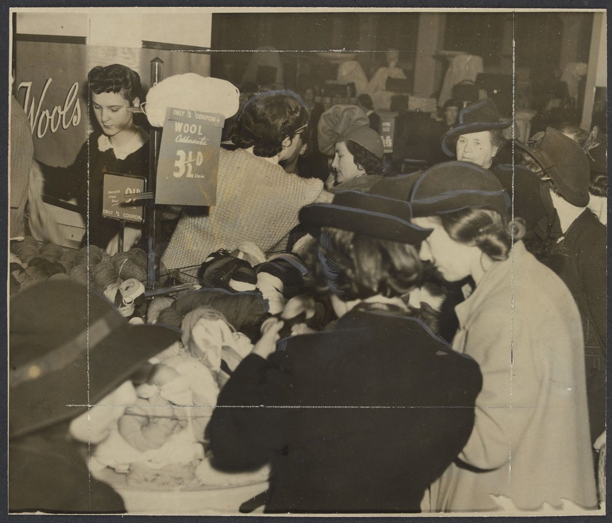 First day of coupon system, women buying skeins of wool using ration books during World War II, Mantons Bourke Street, Melbourne City (1942)