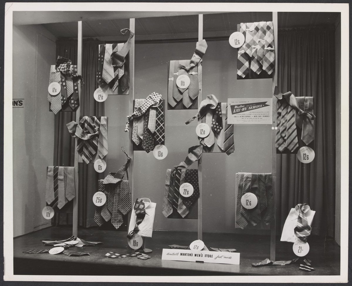 Interior window display of men's silk tipped ties "Available Mantons Men's Store" Bourke Street, Melbourne City (1942–51)