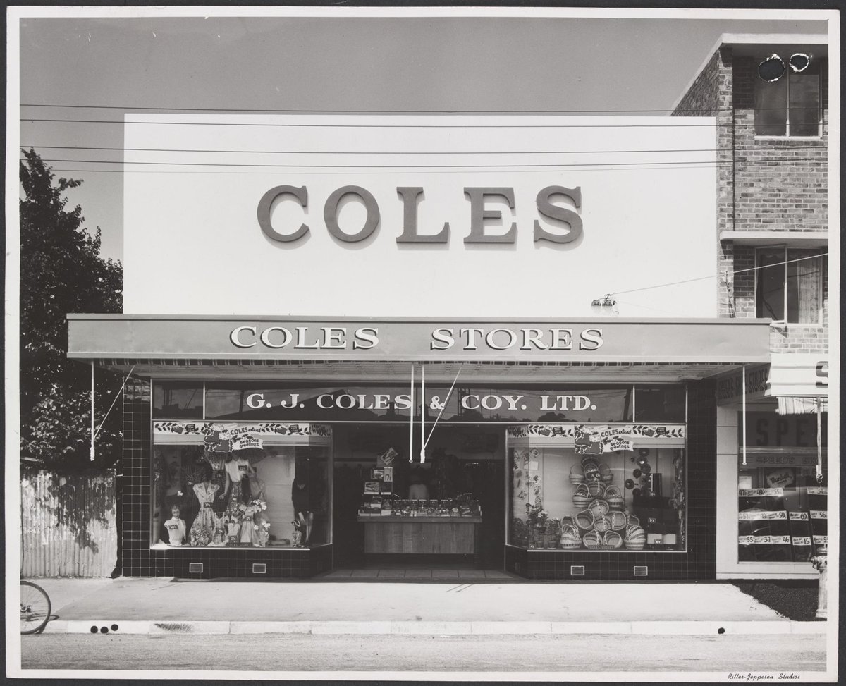 Shopfront window displays featuring women's clothing and cane baskets and decorated with Christmas greetings Mentone Store No. 181 (1953)