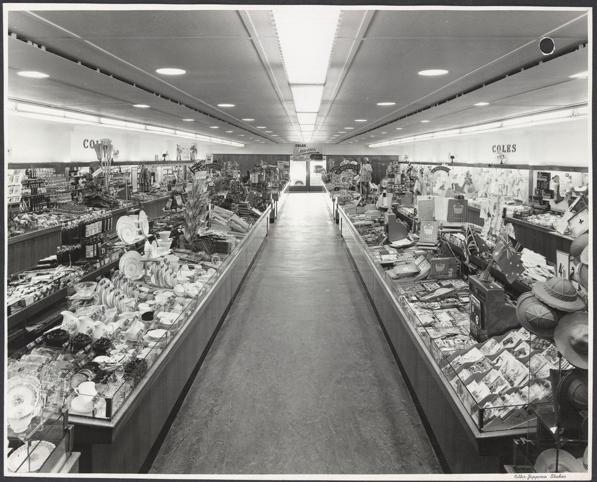 Interior showing counters displaying wide variety of goods with advertisement for Starlet cosmetics at rear of Coles Frankston Store No. 118 (1945–49)