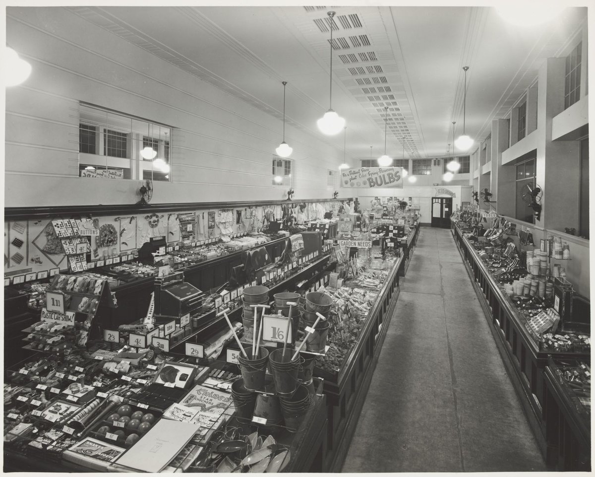 Interior of Coles store Hawthorn with a display of children's toys including buckets and spades and board games at Glenferrie Store No. 17 (1947)