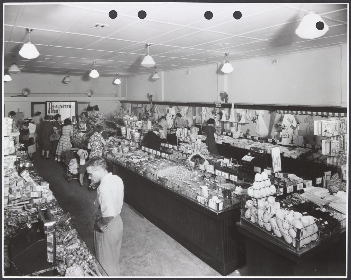 Elevated view of customers at counters displaying household goods clothing and gardening materials in Coles Frankston Store No. 118 (1945–49)