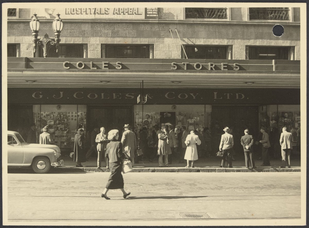 View across street of facade with Hospitals Appeal banner on Coles Bourke Street Store No. 12, Melbourne City (1940–50)