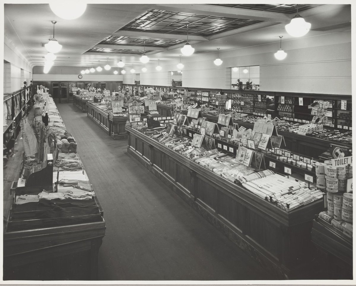 Interior of Coles store with displays of school supplies ranging from 3d to 2/- at Northcote Store No. 16 (1947)