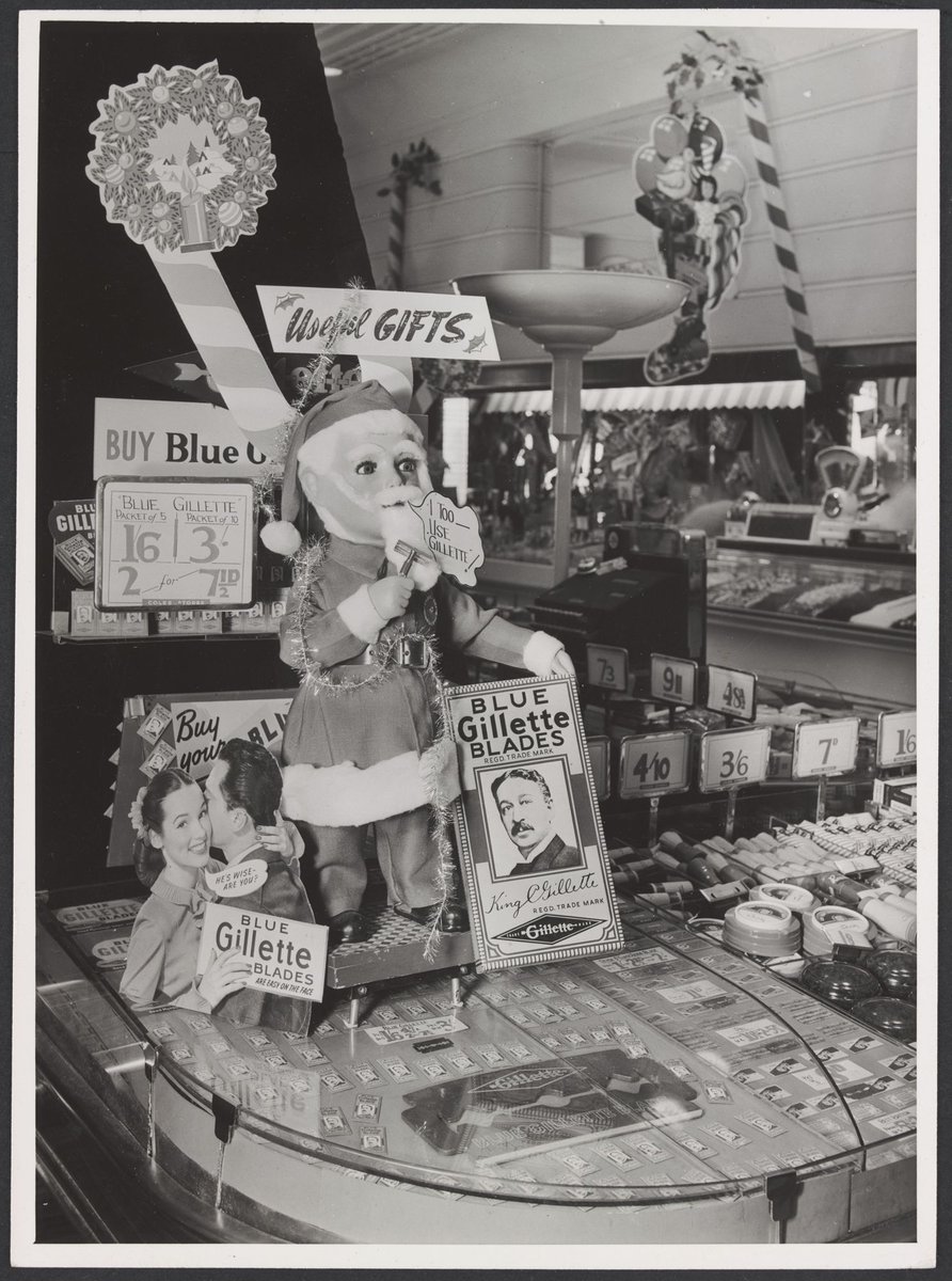 Interior of Coles Swanston Street store displaying Gillette blades and a model of Santa Claus with inscription 'I too use Gillette' Store No. 6, Melbourne City (1949)