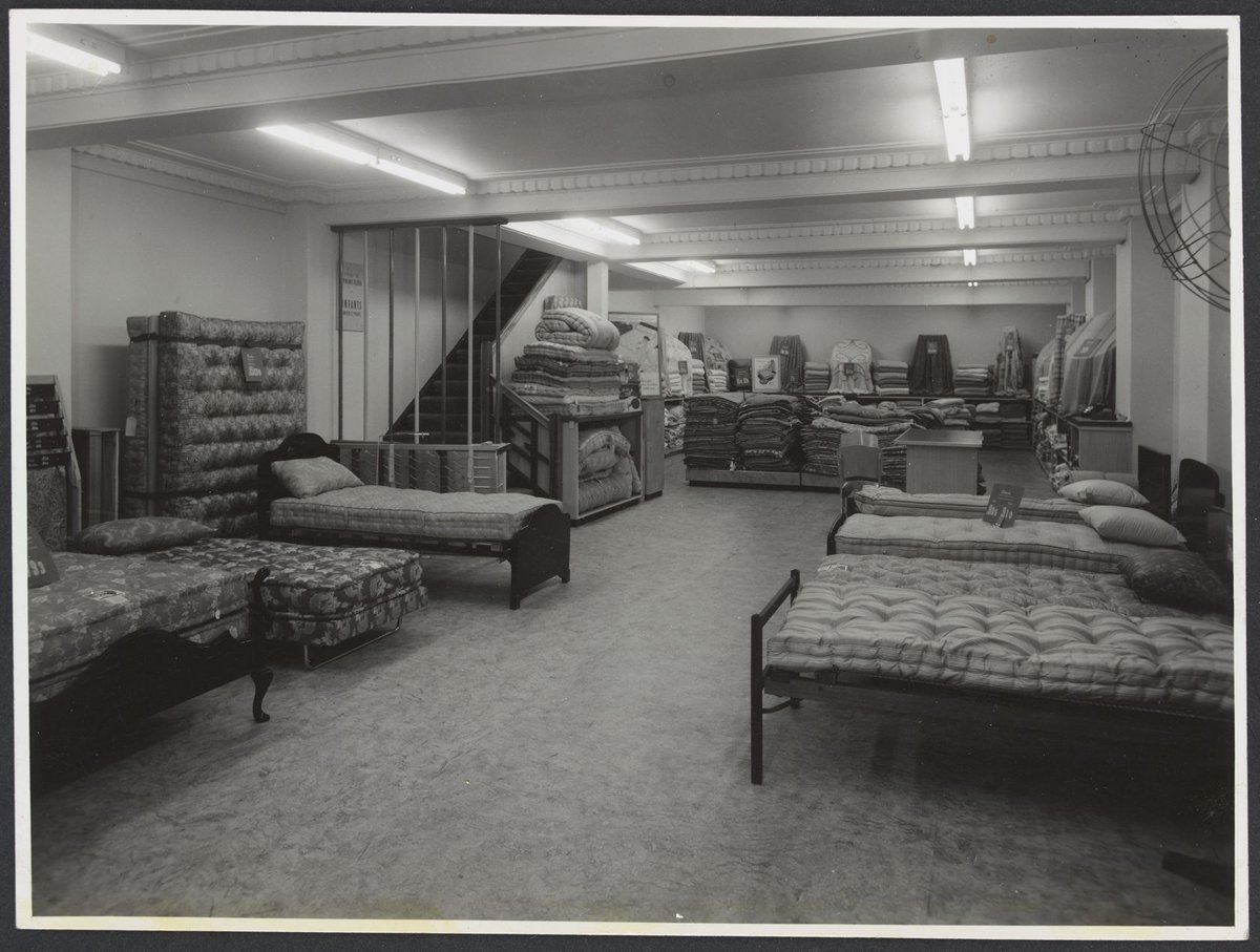 Bedding section with displays of mattresses, eiderdowns, blankets and pillows, Mantons Bourke Street store, Melbourne City (1942–51)