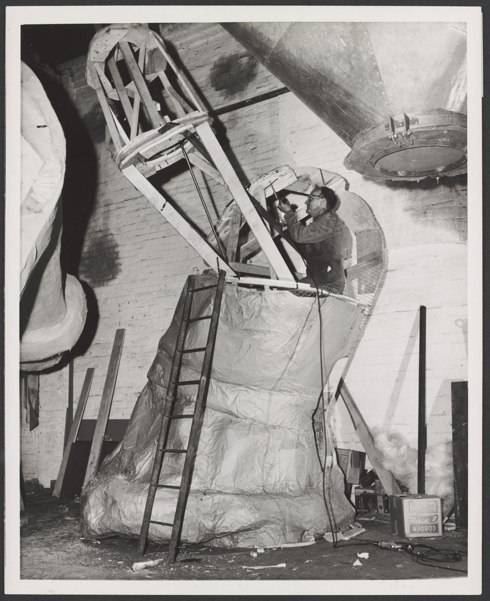 Men working on the construction of the Christmas Facade of Coles Bourke Street Store No. 12, Melbourne City (1954)