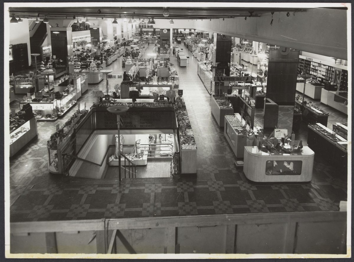 Interior viewed from second floor showing counters and cabinets in aisles, Mantons Bourke Street store, Melbourne City (1942–51)