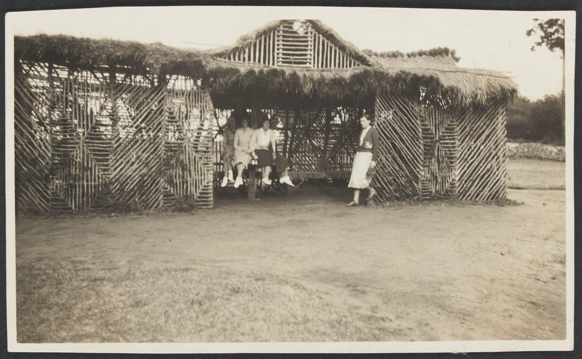 Five women in a shelter at Frankston with four wearing canvas sports shoes (1930–40)
