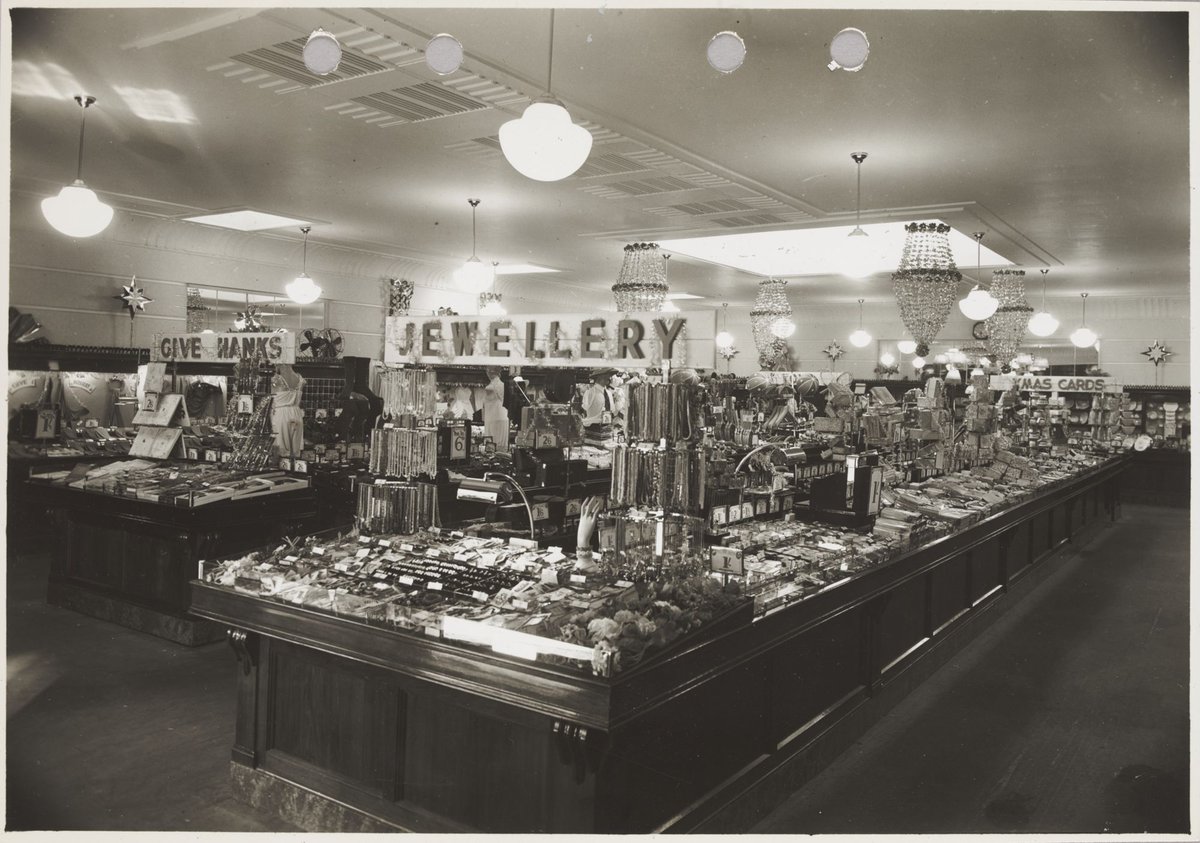 Interior of Coles store with merchandise on display including jewellery and men's ties priced from 6d. Williamstown Store No. 73 (1930–40)