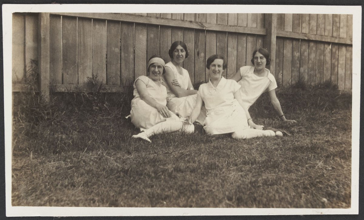 Jean Mill & Ethel and Lois Rogers sitting on grass near a wooden fence at Punt Road South Yarra (1930–40)