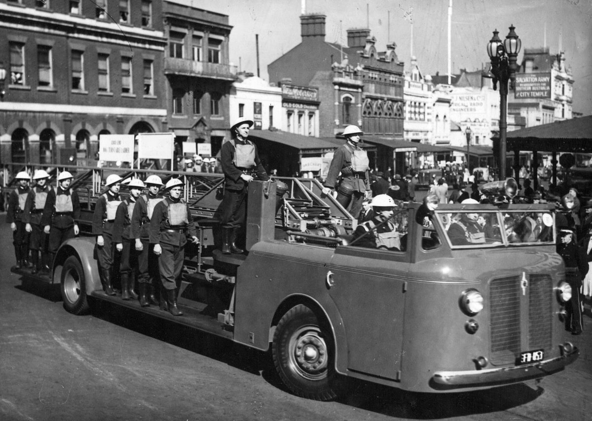Fire truck in civil defence units parade, Bourke Street, Melbourne, Melbourne City (c. 1943)