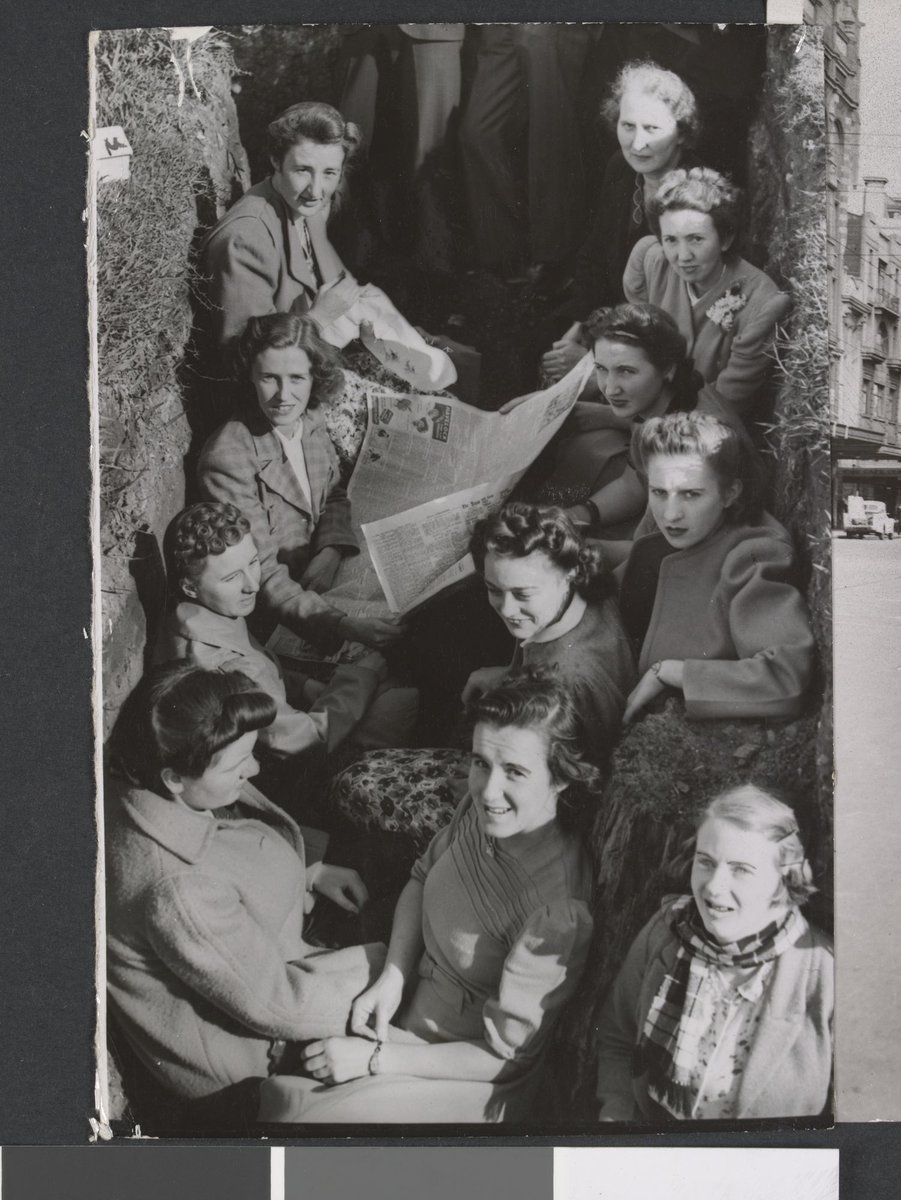 Air raid alerts in Melbourne during World War II - group in an air raid trench, Fitzroy (c. 1942)